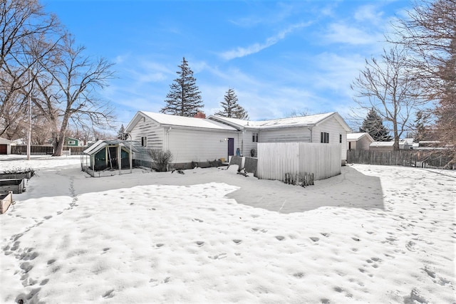 view of snow covered house