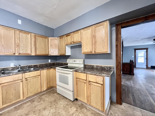 kitchen with light brown cabinetry, sink, and white range with electric cooktop