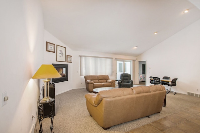 living room with lofted ceiling and light carpet