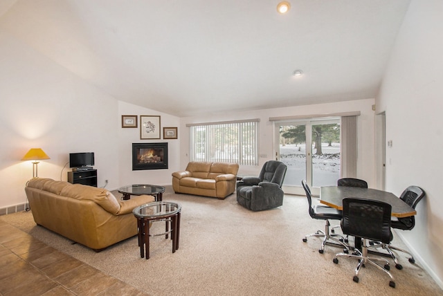 carpeted living room featuring vaulted ceiling