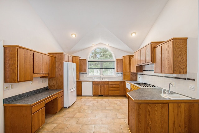 kitchen featuring tasteful backsplash, sink, white appliances, and high vaulted ceiling