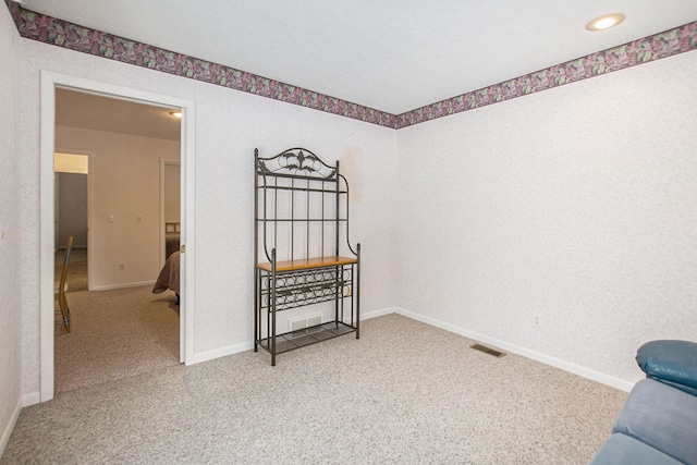 spare room featuring carpet