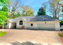 ranch-style home with a garage