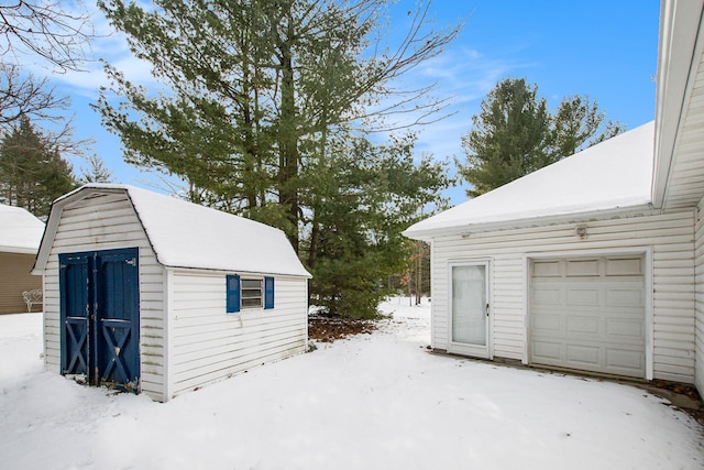 view of snow covered garage