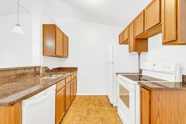 kitchen featuring pendant lighting, sink, and white appliances