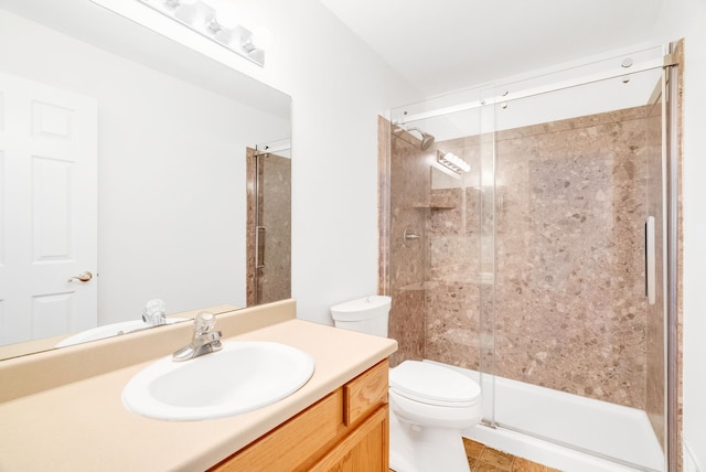 bathroom with walk in shower, vanity, toilet, and tile patterned flooring