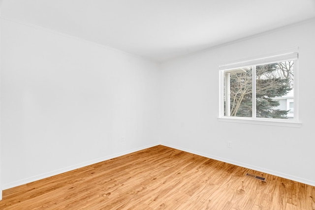 empty room with light wood-type flooring