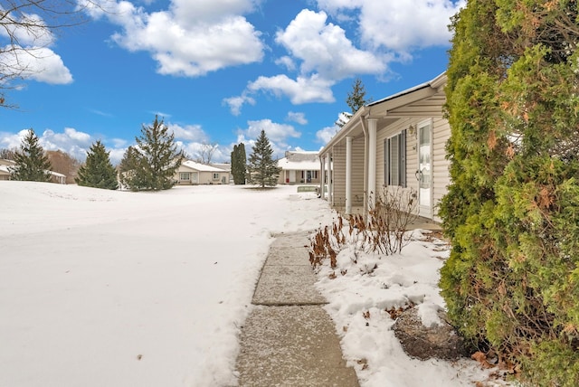 view of yard covered in snow