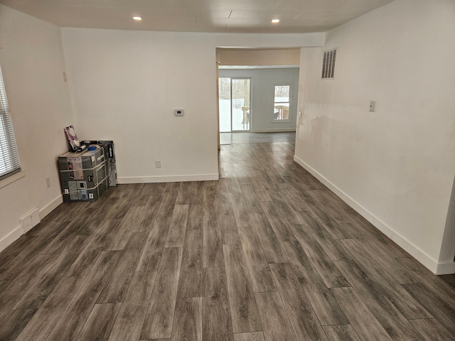 unfurnished room with dark hardwood / wood-style floors