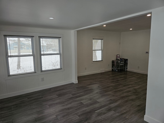 empty room featuring dark wood-type flooring