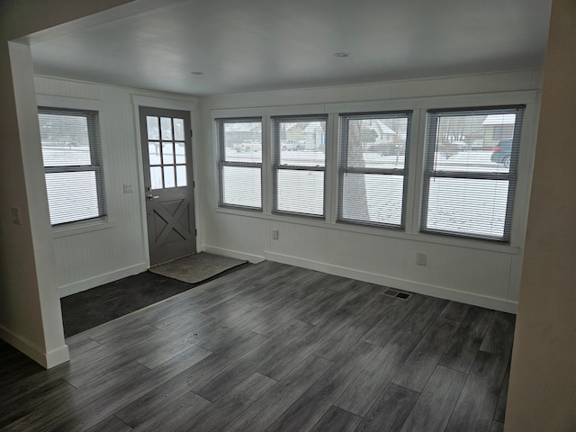 entryway with dark wood-type flooring