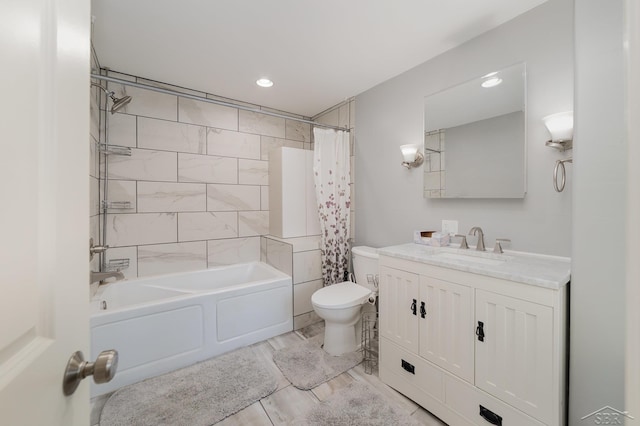 full bathroom with toilet, shower / bath combo, and vanity