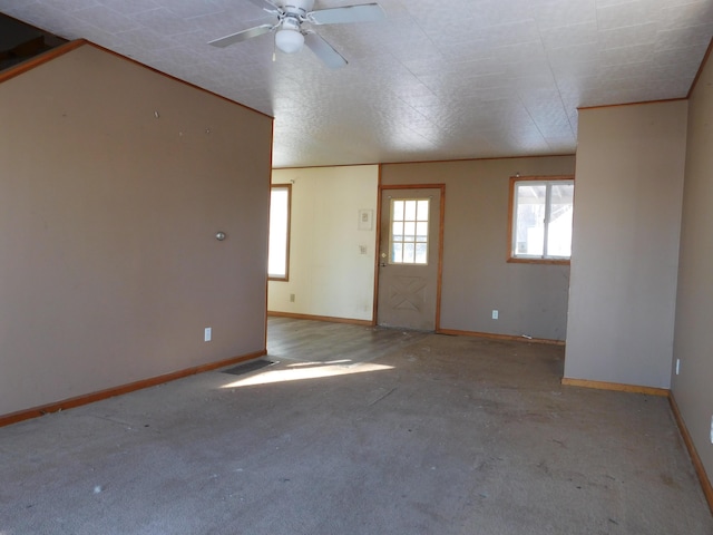 carpeted empty room featuring ceiling fan