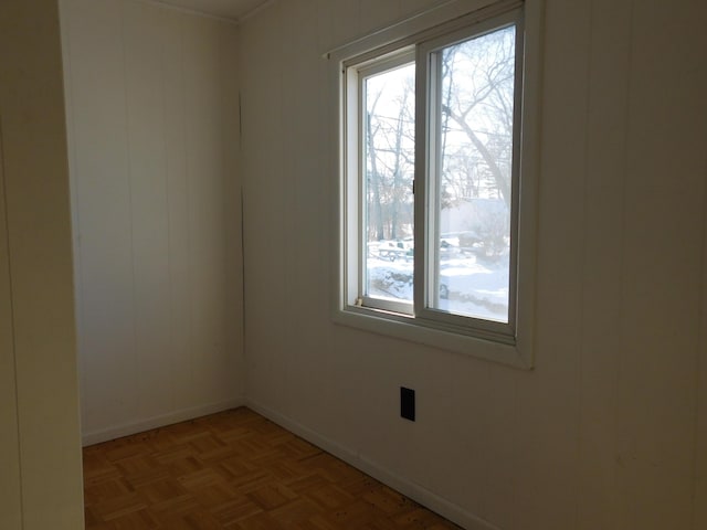 unfurnished room featuring parquet flooring