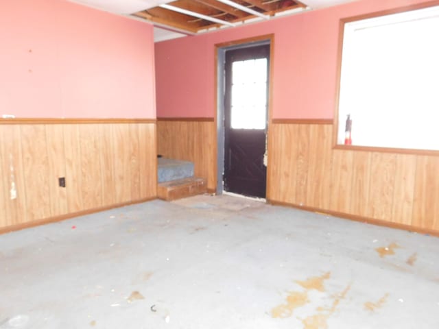 empty room featuring wooden walls