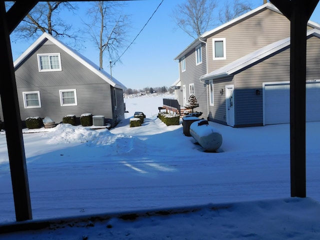 view of snow covered exterior with central air condition unit