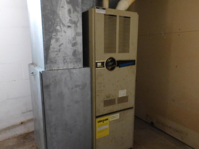 utility room with heating unit