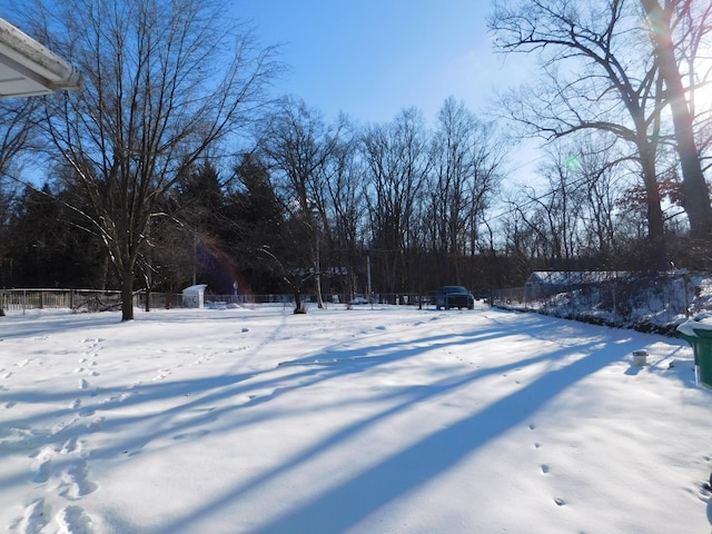 view of yard layered in snow