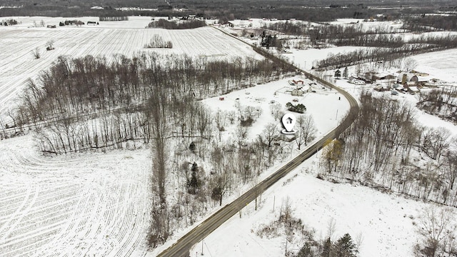 snowy aerial view with a rural view