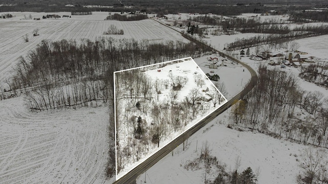 snowy aerial view with a rural view