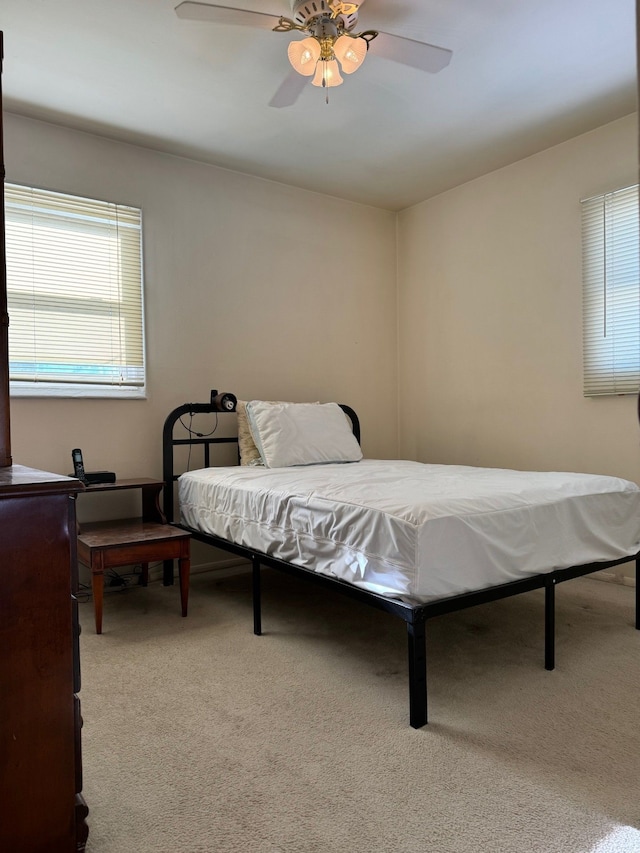 bedroom featuring ceiling fan and carpet floors