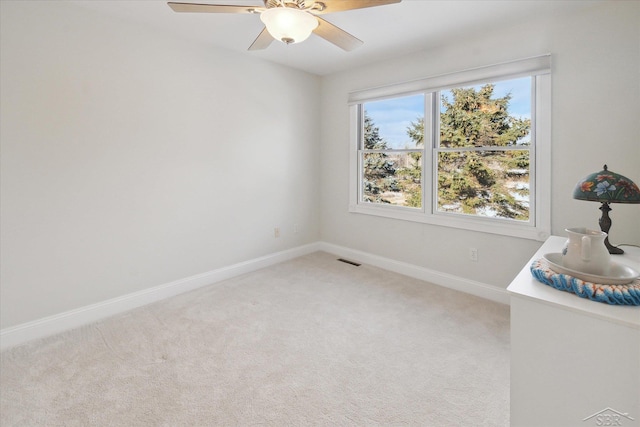 interior space featuring carpet floors and ceiling fan