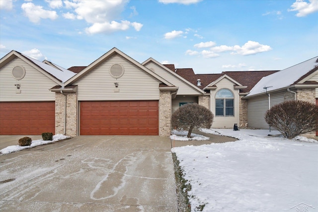 ranch-style home featuring a garage