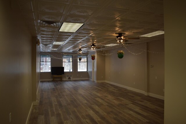 unfurnished room with ceiling fan and dark hardwood / wood-style floors