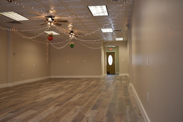 spare room with ceiling fan and hardwood / wood-style flooring