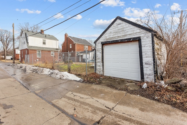 exterior space featuring driveway and fence