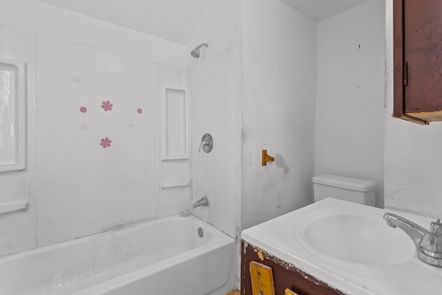 bathroom featuring washtub / shower combination, vanity, and toilet