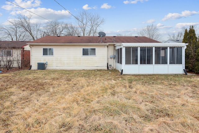 back of house featuring a yard, fence, cooling unit, and a sunroom