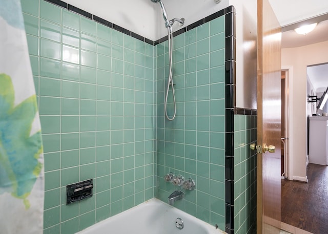 bathroom featuring shower / bathtub combination with curtain