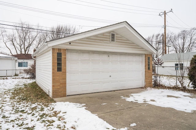 view of snow covered garage