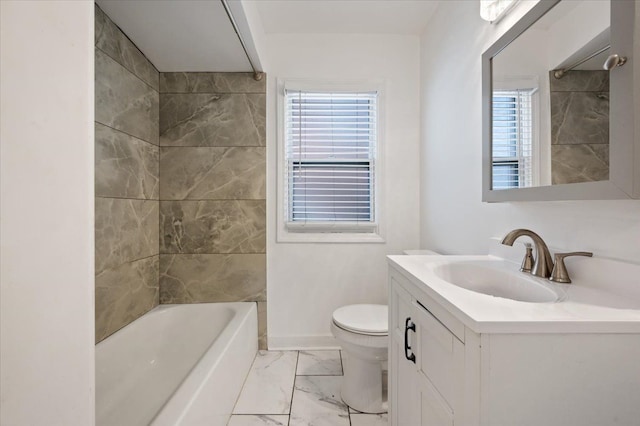 full bathroom featuring tiled shower / bath, vanity, and toilet