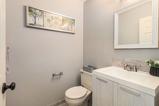 bathroom with toilet and vanity