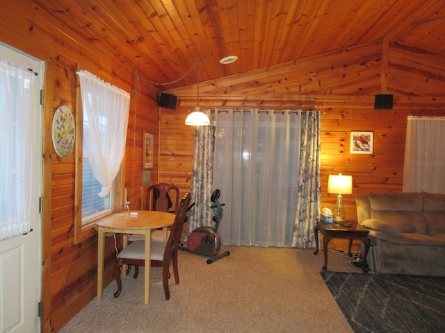 dining area featuring wood walls, wooden ceiling, lofted ceiling, and carpet flooring