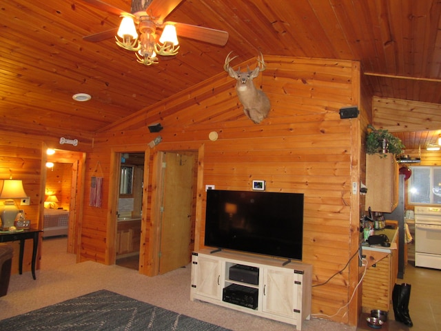 living room with ceiling fan, wood ceiling, and wooden walls