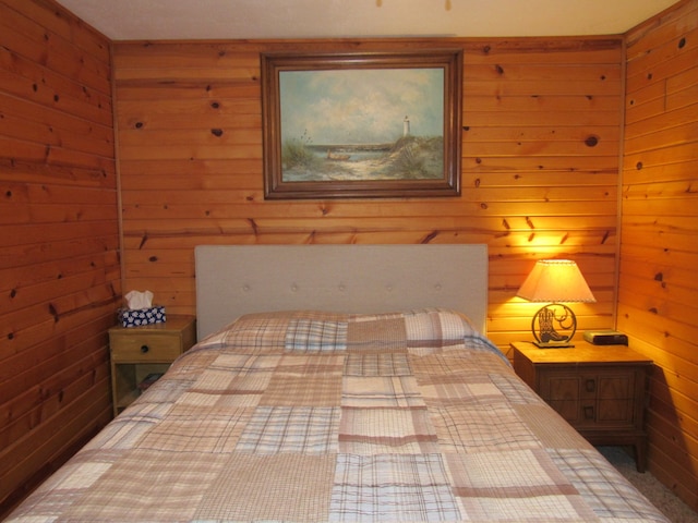 bedroom with wooden walls