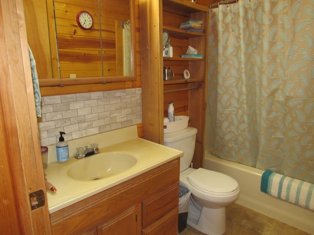 full bathroom featuring vanity, backsplash, shower / bath combo with shower curtain, and toilet