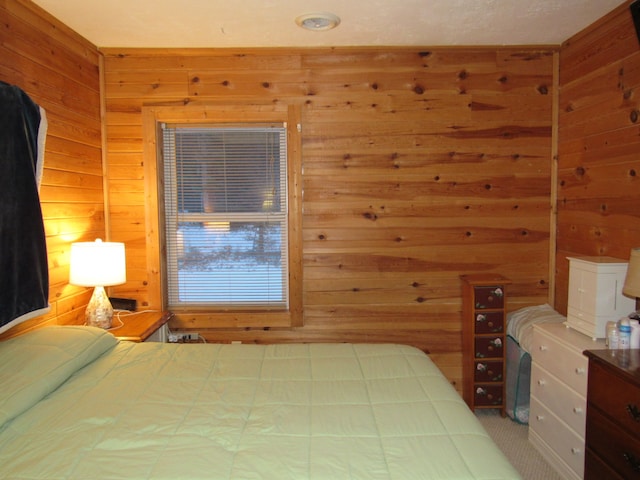 bedroom with wood walls