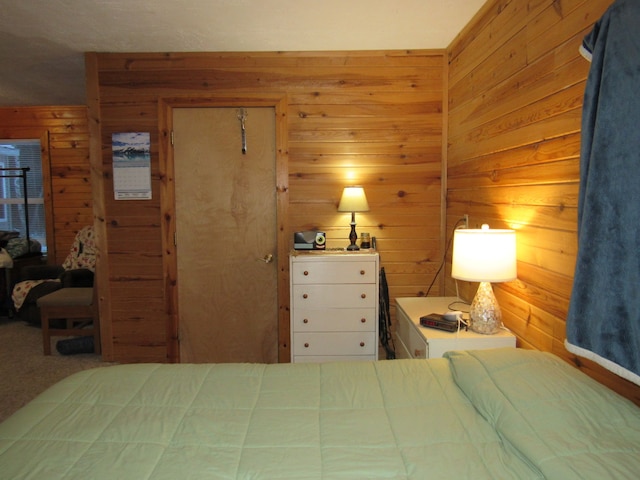 bedroom featuring wood walls