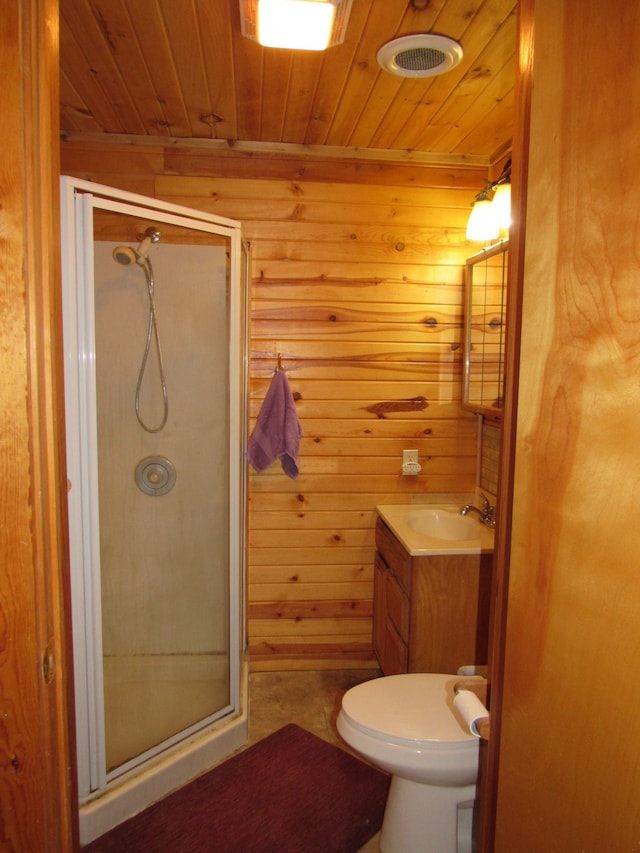 bathroom featuring an enclosed shower, wood ceiling, toilet, vanity, and wooden walls