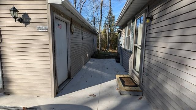 view of property exterior featuring a patio