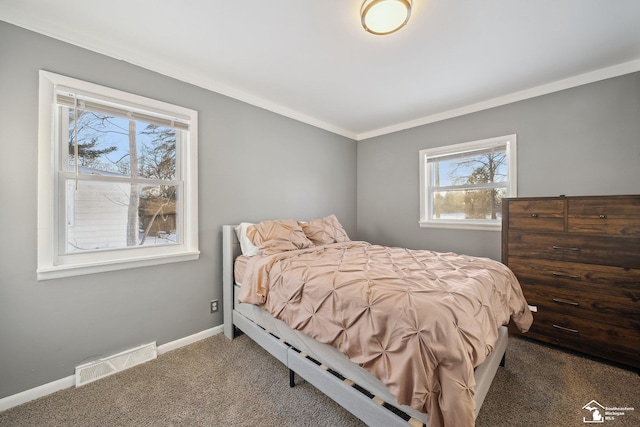 carpeted bedroom featuring ornamental molding