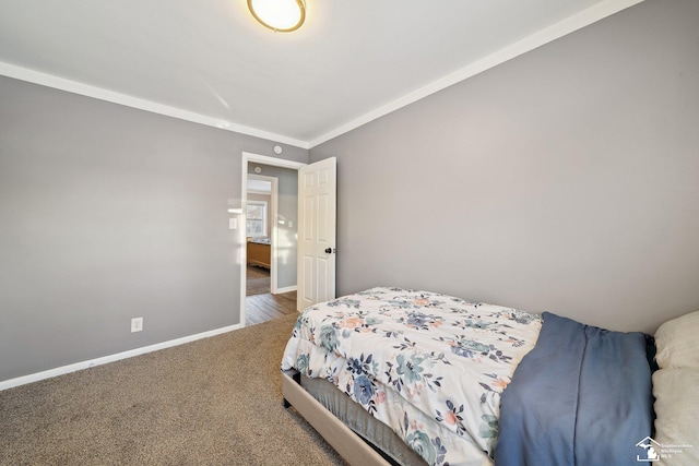 bedroom with carpet and crown molding