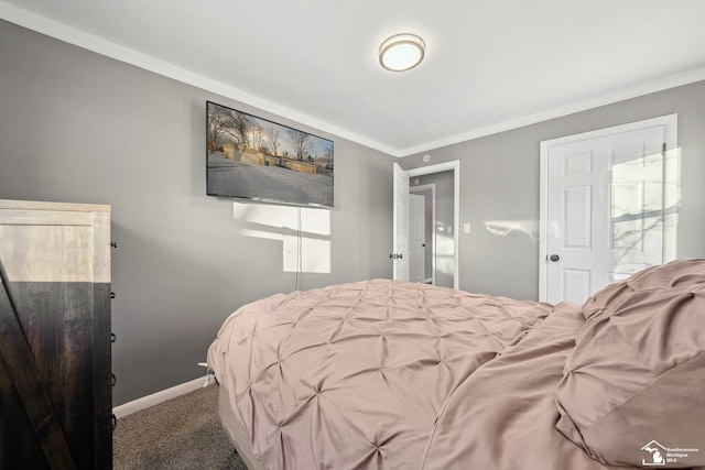 bedroom with carpet floors and crown molding