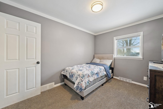 carpeted bedroom with ornamental molding