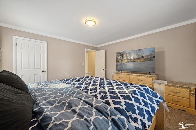 bedroom with carpet floors and ornamental molding