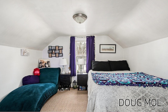 bedroom with carpet and vaulted ceiling